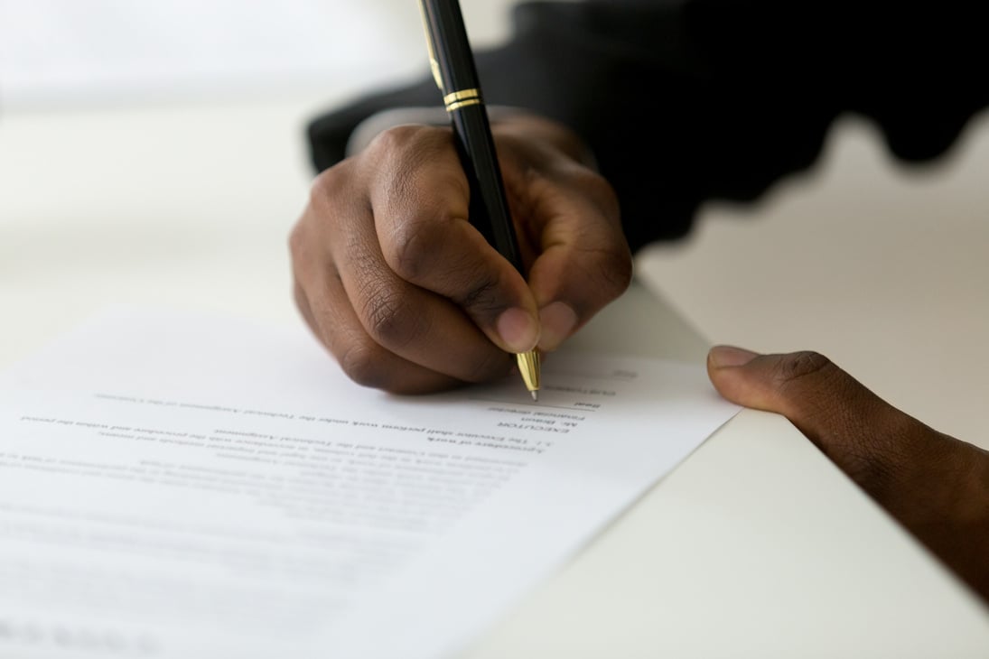 Worker Signing a Legal Documentation